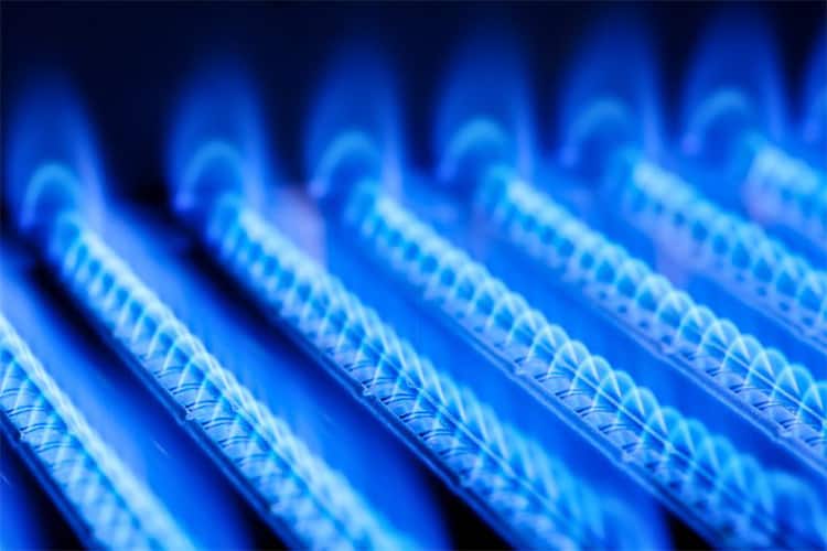 21734092 – blue flames of a gas burner inside of a boiler Natural Gas Solutions