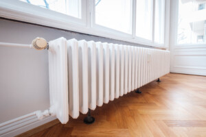 Radiator in an upscale home with hardwood floors