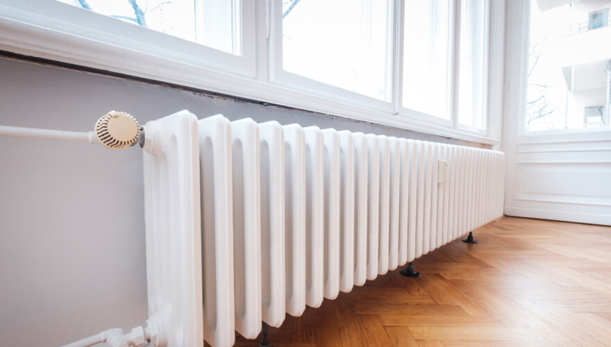 Radiator in an upscale home with hardwood floors
