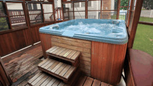 A hot tub in the backyard of a suburban home.