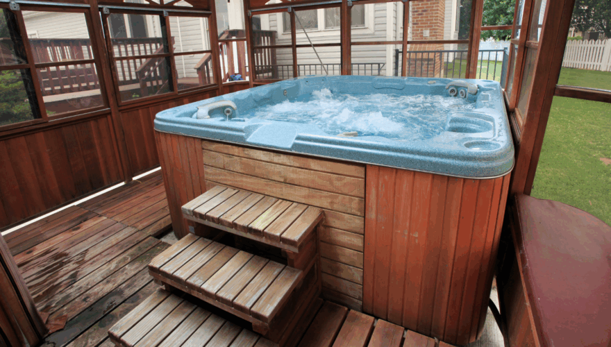 Hot tub on a wooden deck with enclosed porch, outdoor relaxation, home spa, backyard hot tub, luxurious outdoor hot tub, Agway Energy Services.
